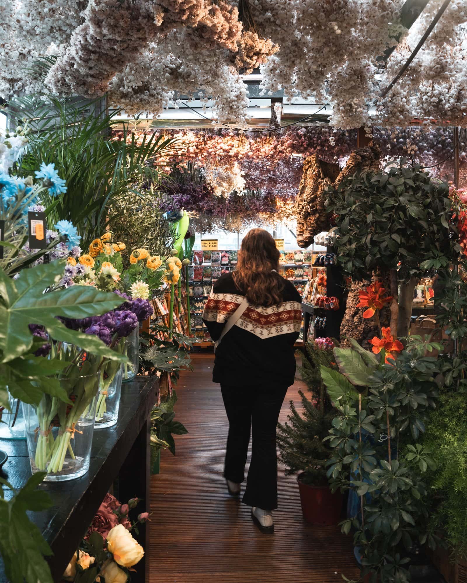 Anna at a flower shop at Bloemenmarkt