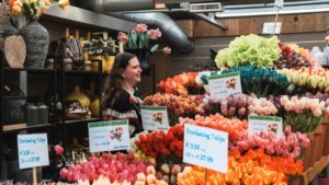 Anna at a flower shop at Bloemenmarkt